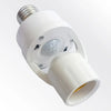 A white PIR motion sensor light bulb adapter with a threaded base and a cylindrical fitting.