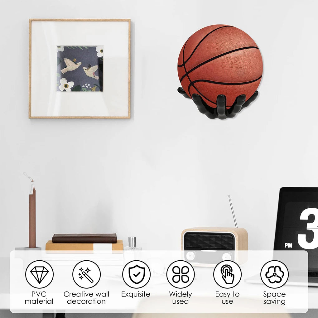 A basketball and a football are displayed as wall decor against a white background.