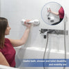 A person installing vacuum suction cup shower grab bars on a white tiled wall.