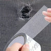 A hand is applying reusable window repair tape to a mesh mosquito screen, demonstrating its use for repairs.