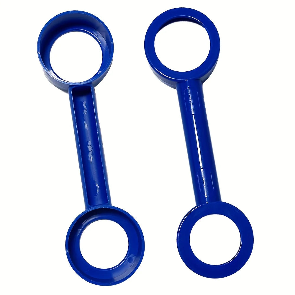 A pair of blue multi-surface paint scraper tools with oval handles and circular tips.