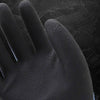 Close-up of a black double layer latex coated work glove with a blue cuff.
