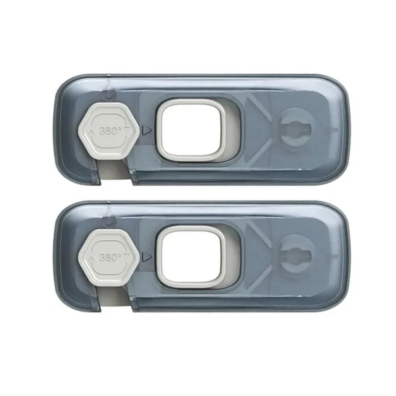 A set of three clear plastic cabinet safety locks for toddlers, featuring a round and oval design.