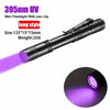 A black mini flashlight with a pen clip emitting purple UV light for inspection.