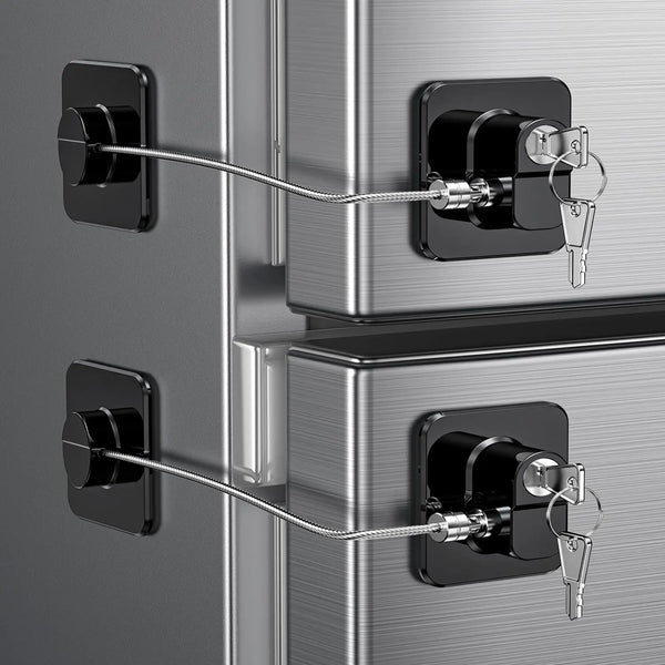 Close-up of a silver baby safety cabinet with black locks and silver chains securing the drawers.