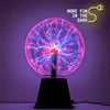 A glowing pink plasma ball light display with purple electrical arcs on a dark background.