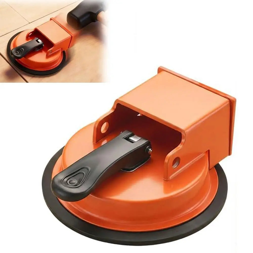 An orange heavy duty suction cup floor gap fixer tool with a black handle and base.