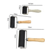 A set of professional rubber roller printing tools shown with various sizes and handles.