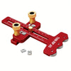 A red precision thin rip table saw jig with measuring scales and clamping components.