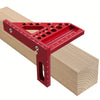 A red precision aluminum square protractor is shown resting on a light wood plank.