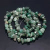 A string of tumbled green and yellowish natural agate beads for DIY jewelry making.