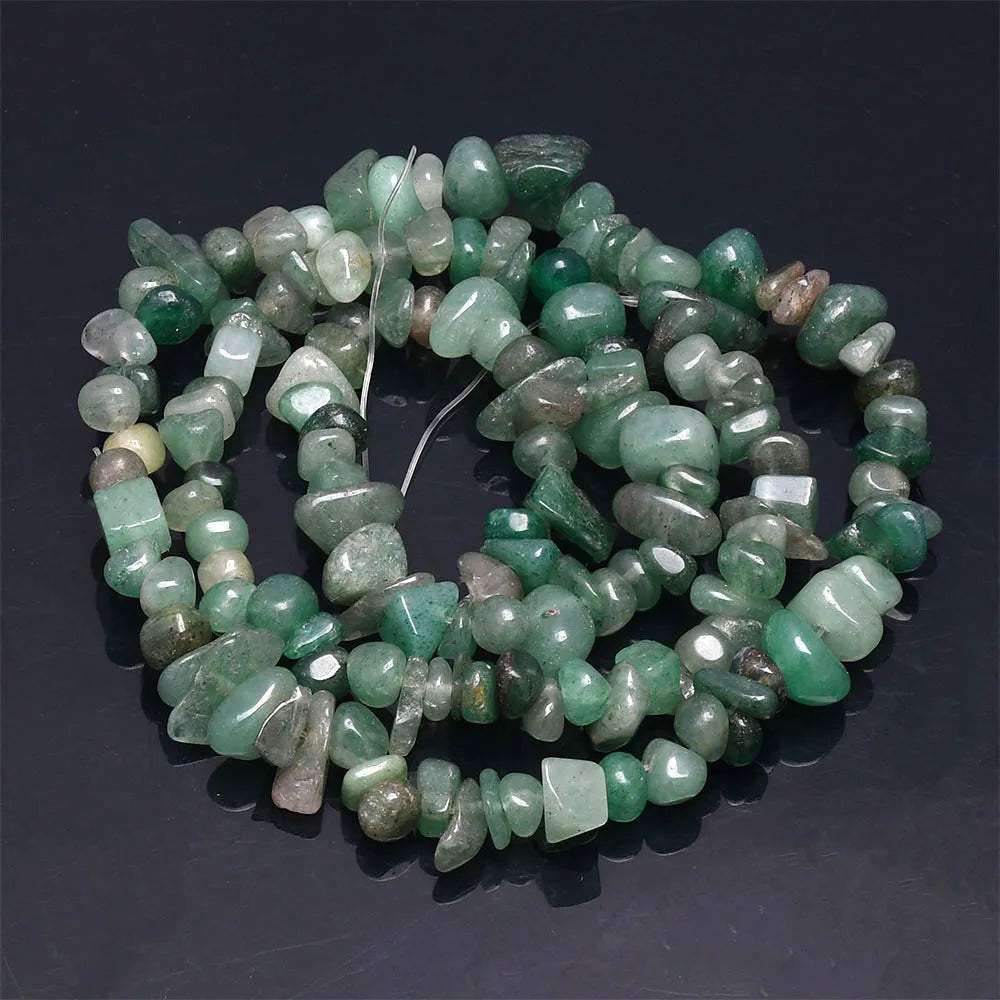 A string of tumbled green and yellowish natural agate beads for DIY jewelry making.