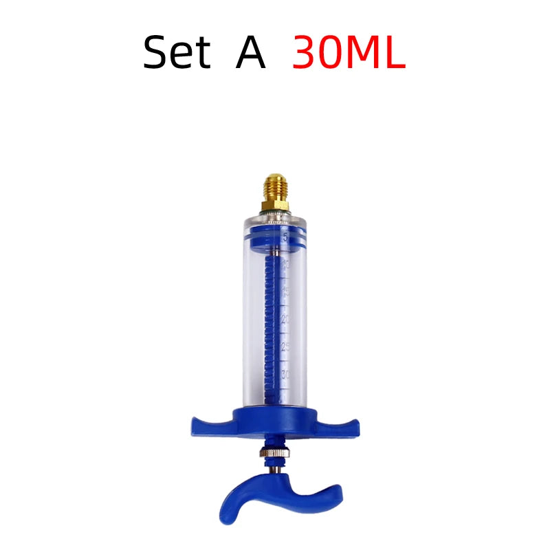 A blue precision oil and dye injector set labeled Set A 30ML with a gold threaded top.