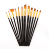 A set of twelve black nylon flat paint brushes with varying sizes and golden ferrules arranged diagonally.