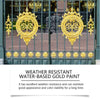 A pair of ornate gold-colored metal doors with decorative ironwork and foliage.