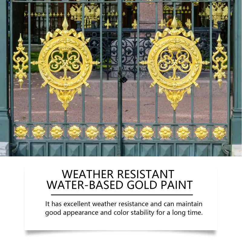 A pair of ornate gold-colored metal doors with decorative ironwork and foliage.