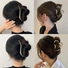 A set of elegant gold S-shaped metal hair clips styled in various updos and buns.