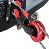 Close-up of a heavy-duty synthetic winch rope and recovery shackle attached to a black metal bracket.