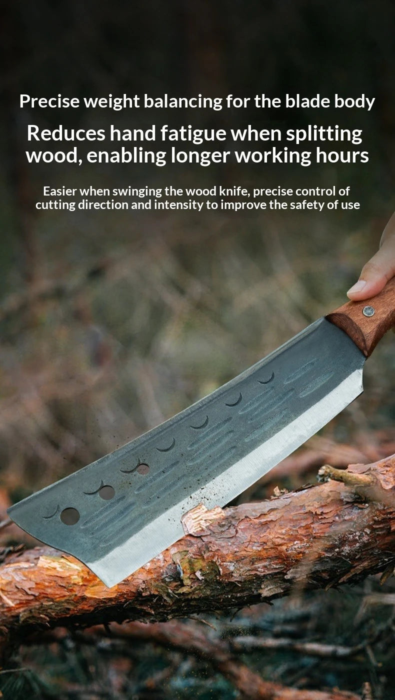 A close-up of a forged tree chopping axe blade resting on a piece of wood.