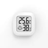 A white compact digital thermometer displaying a temperature of 25.6°C and 38% humidity.