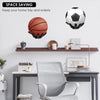 Wall decor featuring a basketball and a football mounted on a wooden shelf above a desk.