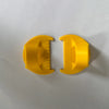 A pair of yellow plastic templates for hand sewing edge lockstitch stitches.