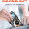 A hand holds a compact digital multimeter with a large display, demonstrating its portability for travel.