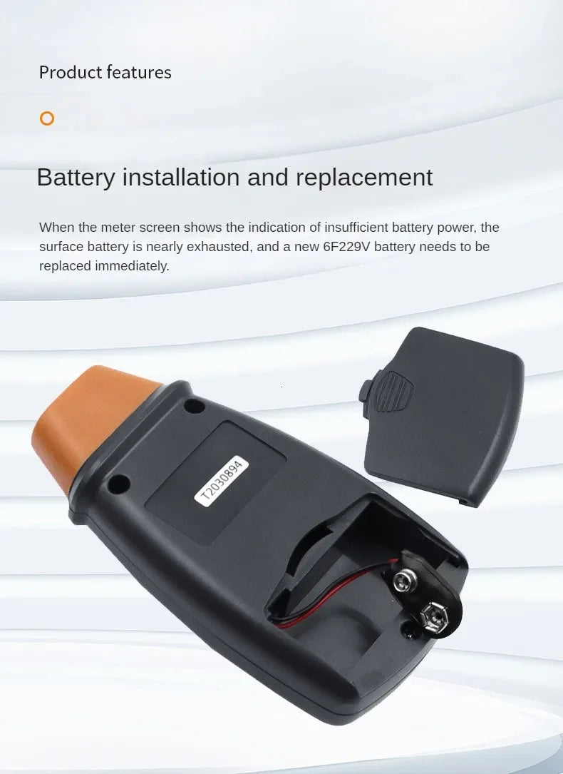 A black battery installation and replacement kit for a meter, showing the battery holder and a separate battery component.