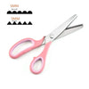 Pair of pink and silver stainless steel zigzag tailor scissors with measurement markings