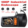 A black 1080P industrial endoscope with a coiled cable and battery, designed for pipe and drain inspection.
