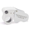 A white foldable LED magnifier with a lens and multiple identifying types for jewelry inspection.