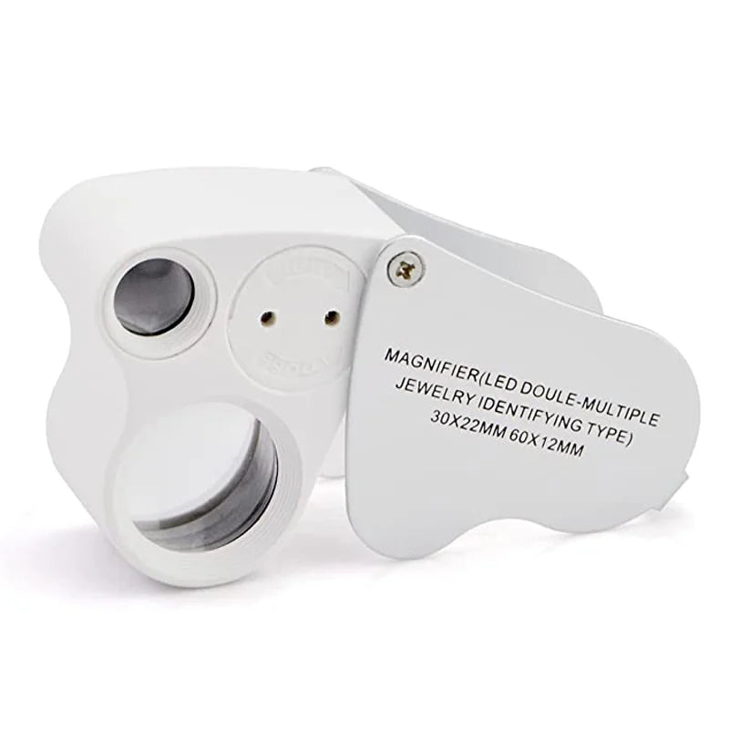 A white foldable LED magnifier with a lens and multiple identifying types for jewelry inspection.