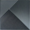 A close-up view of black, ribbed 3D diamond PVC wall panels arranged in a sharp diagonal pattern.