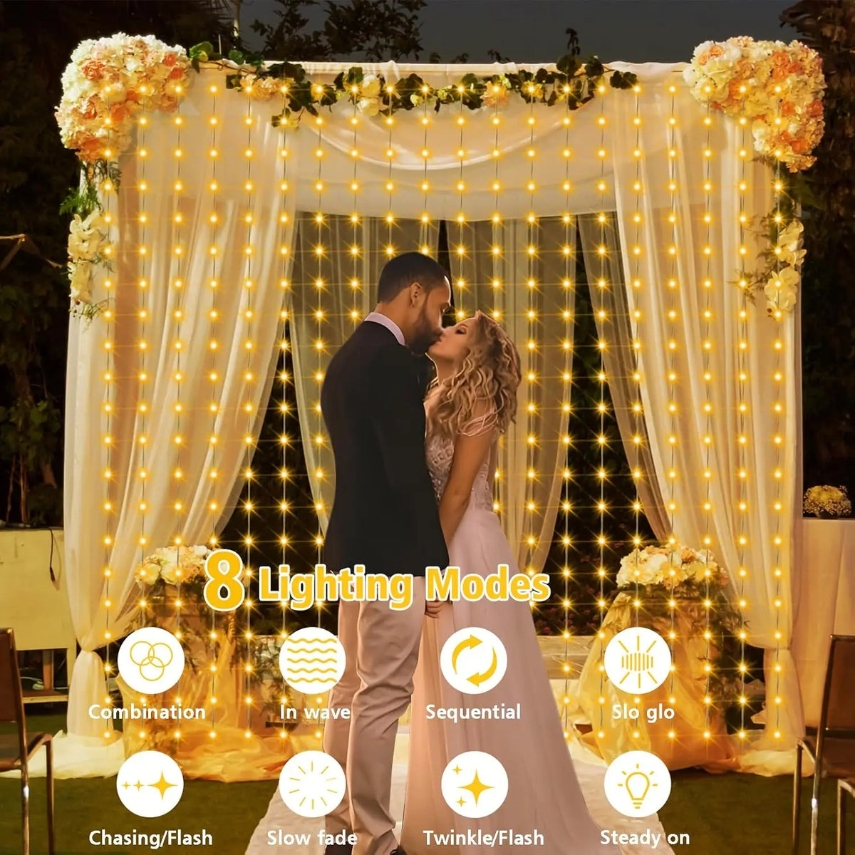A couple is featured in a softly lit backdrop decorated with sheer curtains and string lights for an outdoor event.