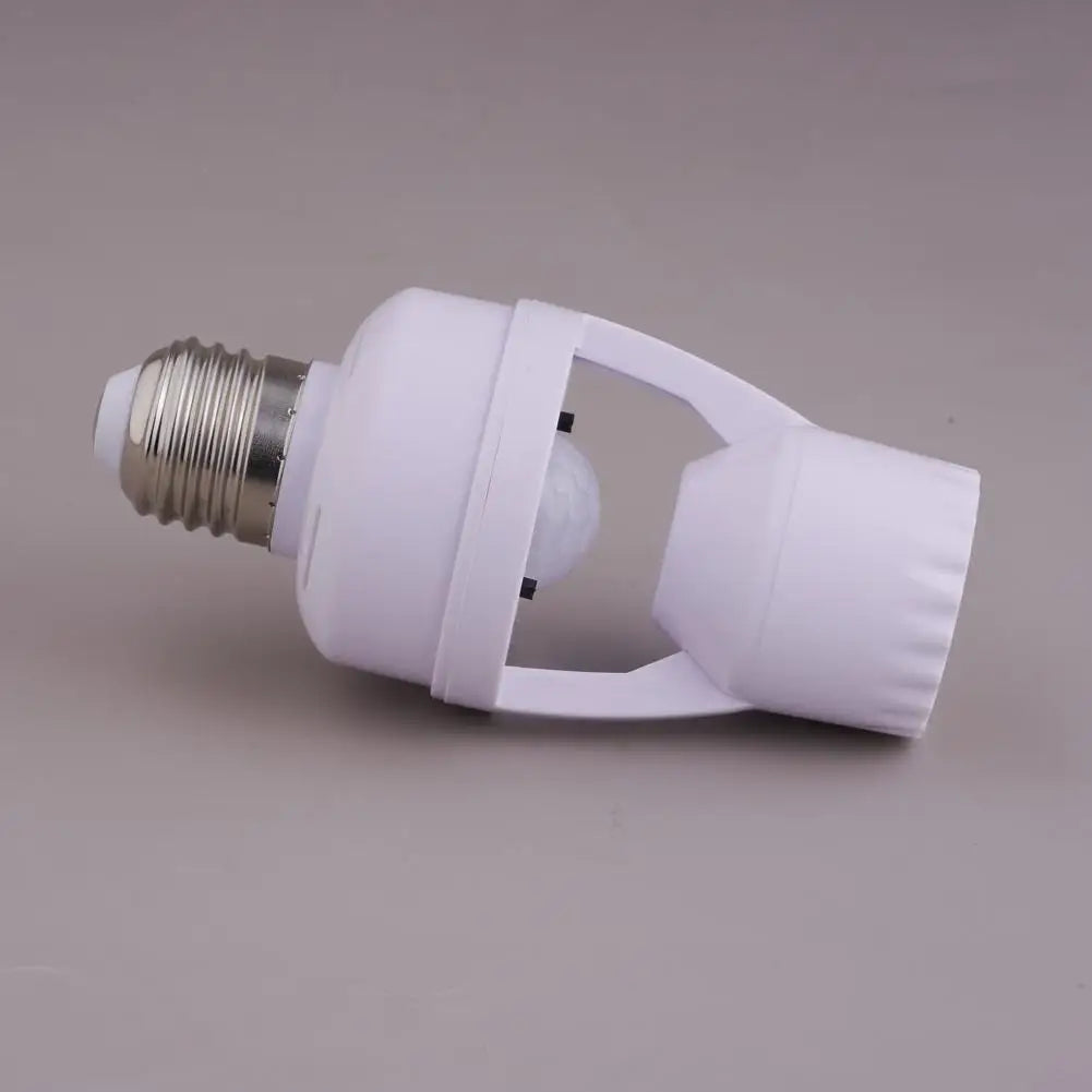 White adapter for a PIR motion sensor light bulb with a screw base.