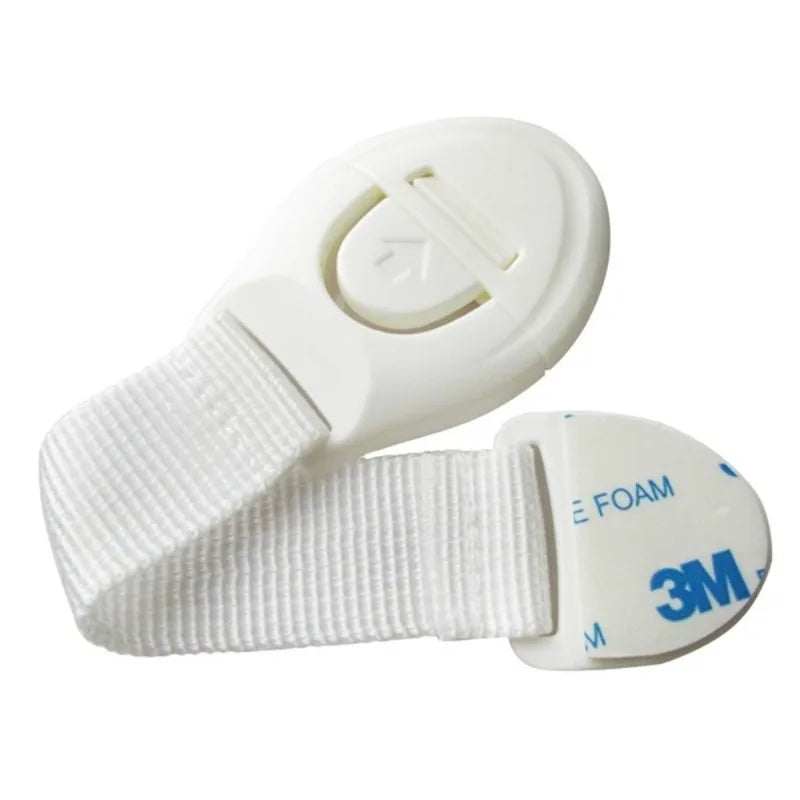 A white silicone safety clip is shown attached to a white strap, used for securing doors or drawers.