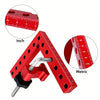 A red precision woodworking right angle clamp shown with inch and metric rulers for measurement.