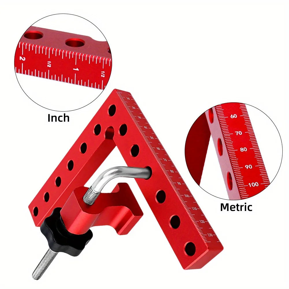 A red precision woodworking right angle clamp shown with inch and metric rulers for measurement.