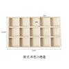 A rectangular light beige jewelry storage tray with 15 compartments for velvet jewelry.