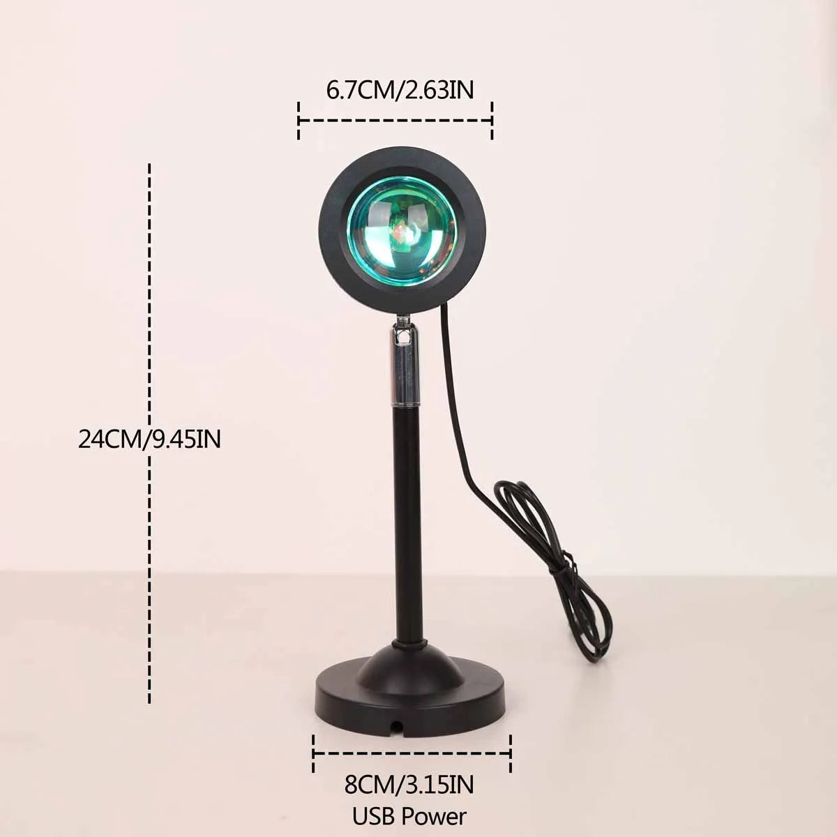 A black USB sunset projection light with a circular lens and stand is shown against a white background.