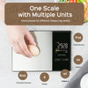 A hand places an egg on a digital kitchen scale displaying 29.28 fluid ounces and various unit options.