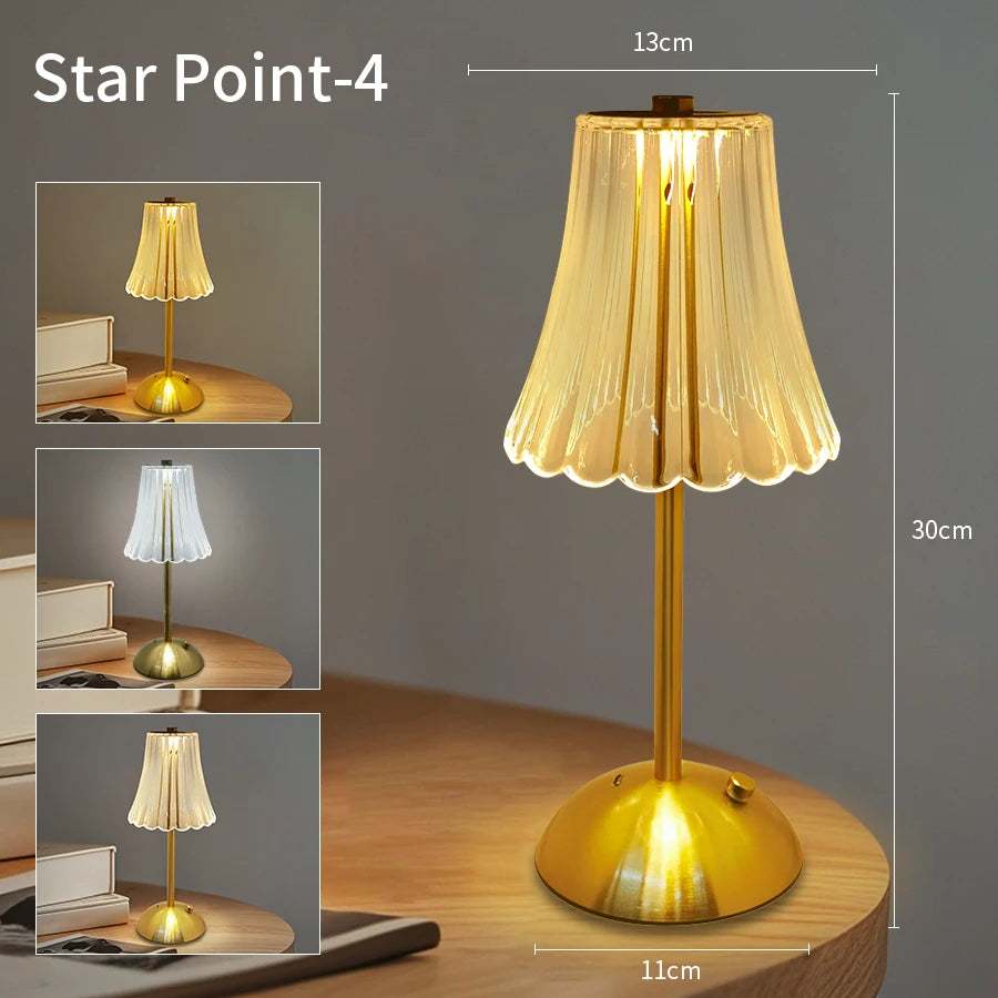 A tall, gold-toned desk lamp with a translucent shade and a brass base, shown in various angles.