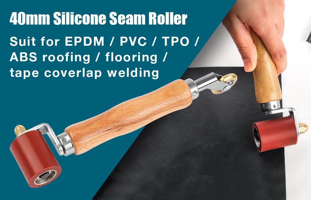 A hand is holding a 40mm silicone seam roller with a wooden handle and a red roller, used for welding various materials.