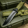 A full tang fixed blade knife with a green handle is resting on a military-style green field kit box.