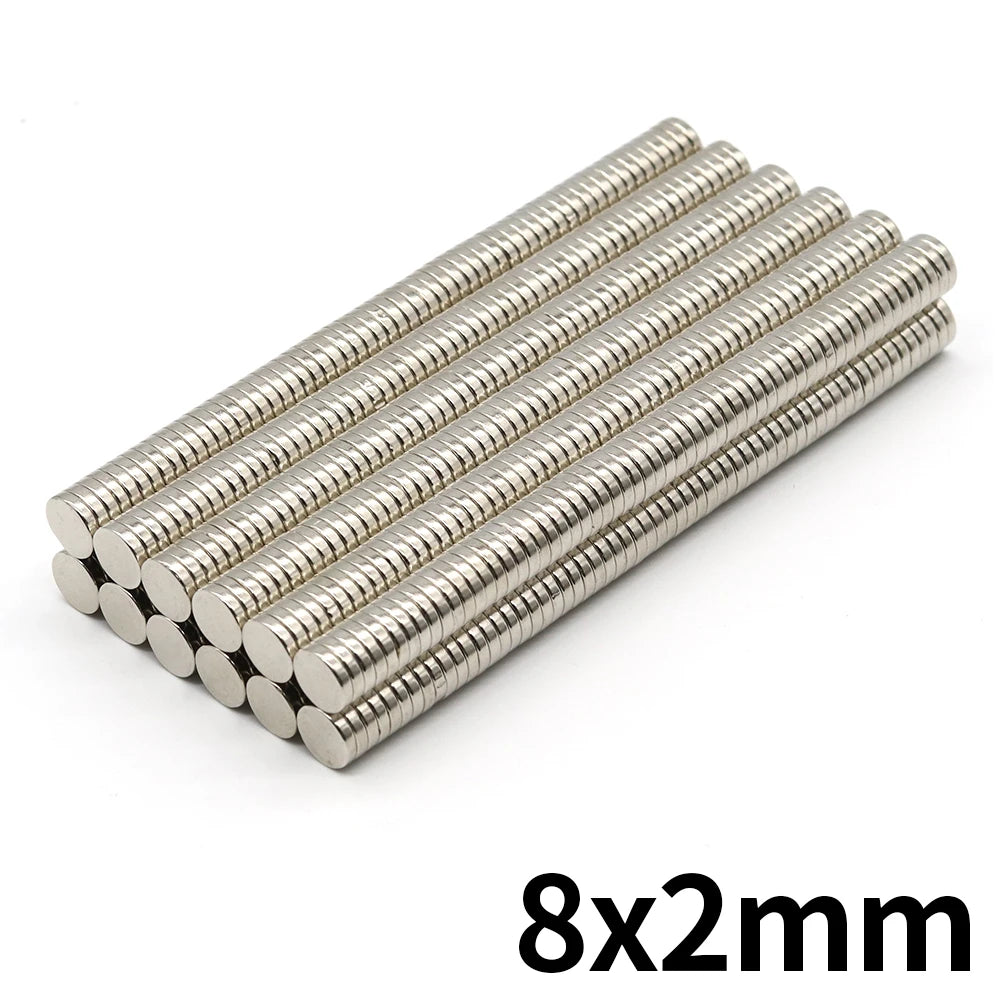 A set of 8x2mm refrigerator magnets with a silver finish arranged in a diagonal line.