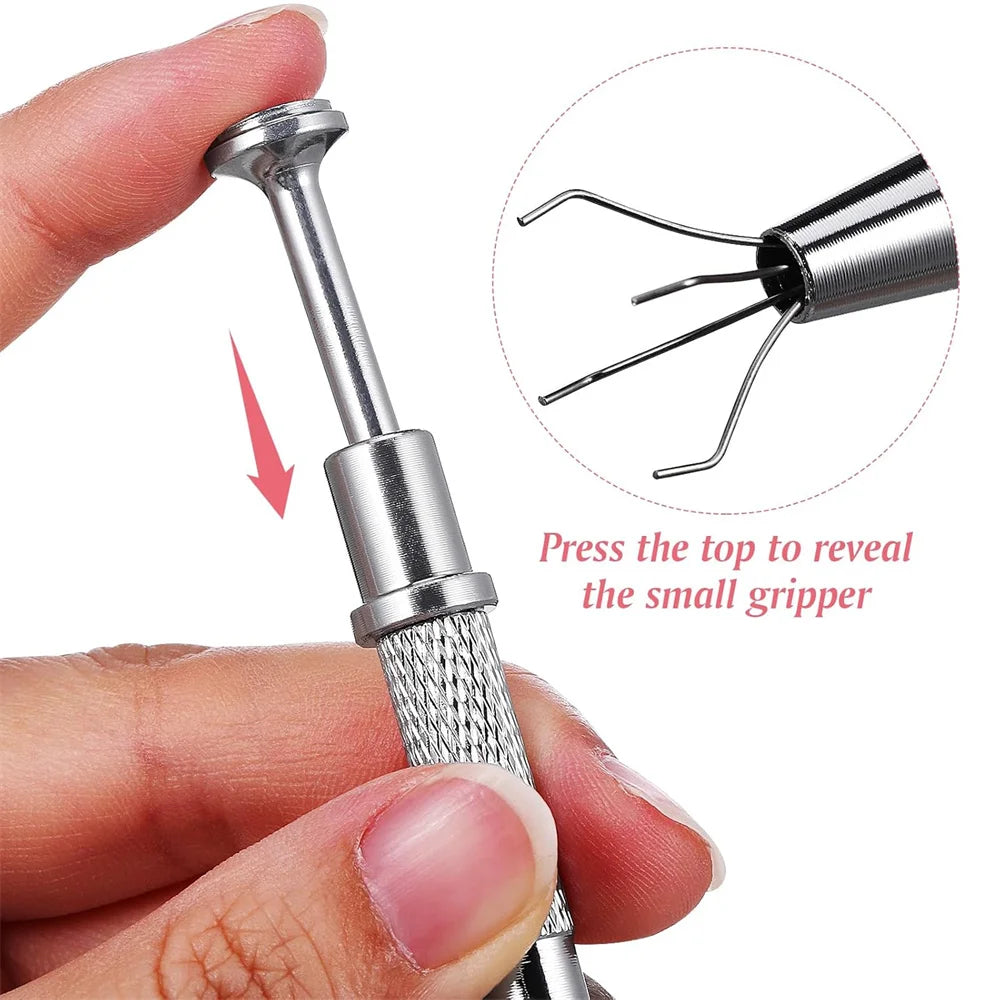 A hand is pressing a metal tool to reveal a small gripper, demonstrating the nail art sponge set with grabbing pen.