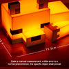 An orange, cube-shaped night light or desk lamp with a fox design, shown on a wooden surface.