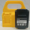 A yellow battery storage rack holding a black rechargeable lithium ion battery DCB200