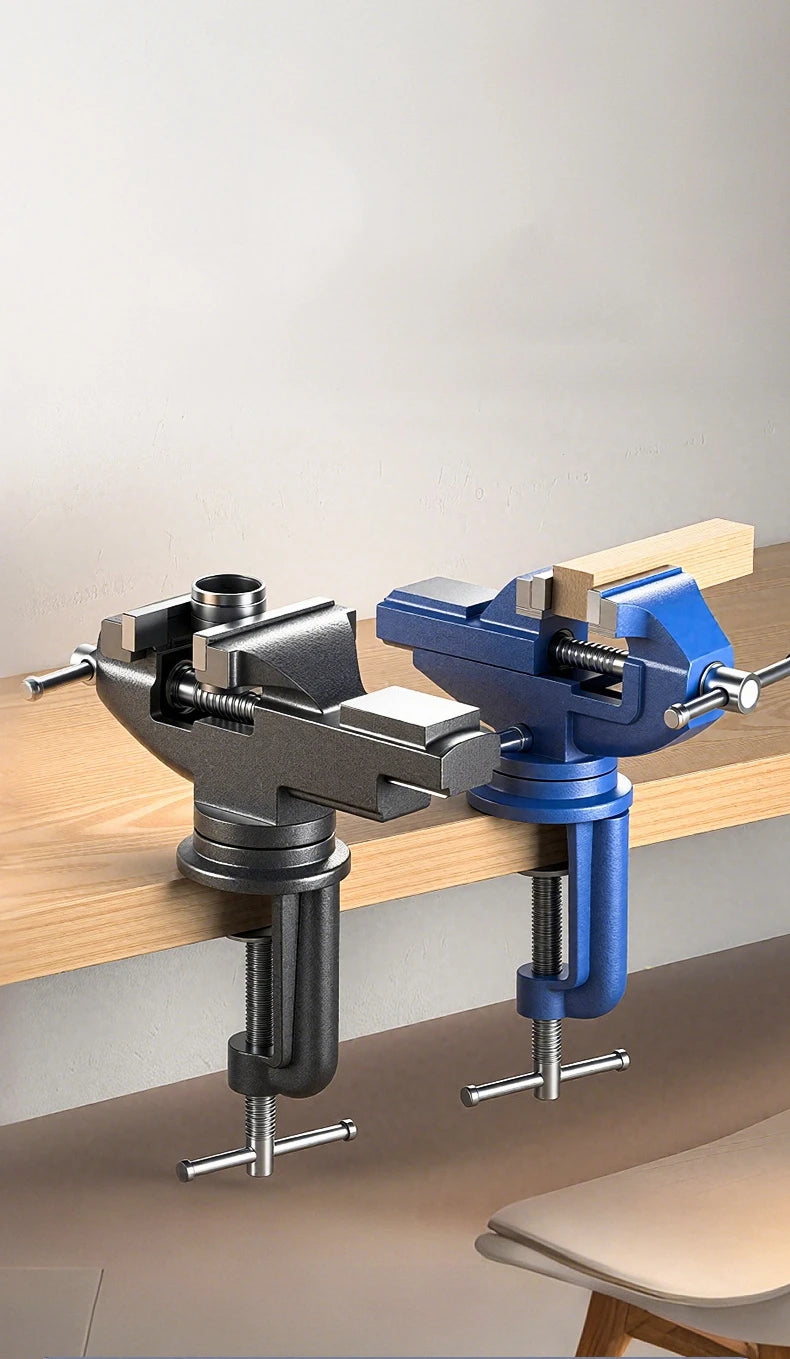 A heavy duty 360° rotating table vise in gray and blue metal is shown mounted on a wooden surface.