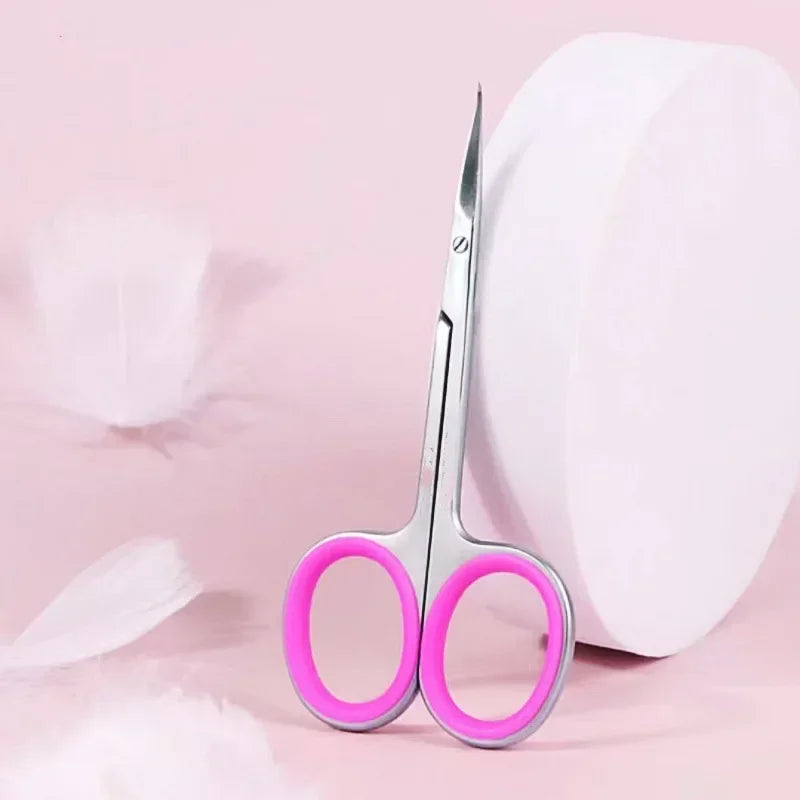 A pair of professional stainless steel nail cuticle trimmers with bright pink handles resting on a white background.